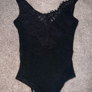 Black lace body suit with open back